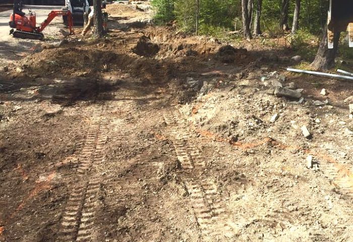 Initial site excavation for a created stream feature alongside the driveway, Beargrass Landscape Architecture